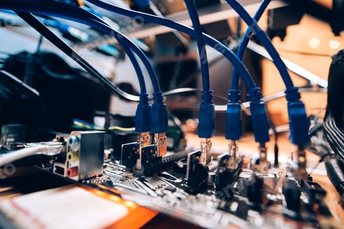 Preview: Close up details of mining rig, graphics cards cables and motherboard.