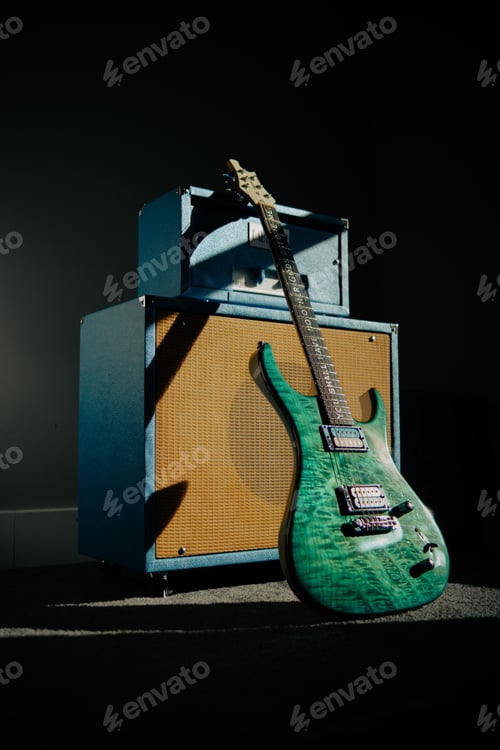 Preview: Vertical shot of a green electric guitar