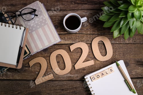 Preview: Office desk table with notebooks, coffee cup. New year 2020 resolutions