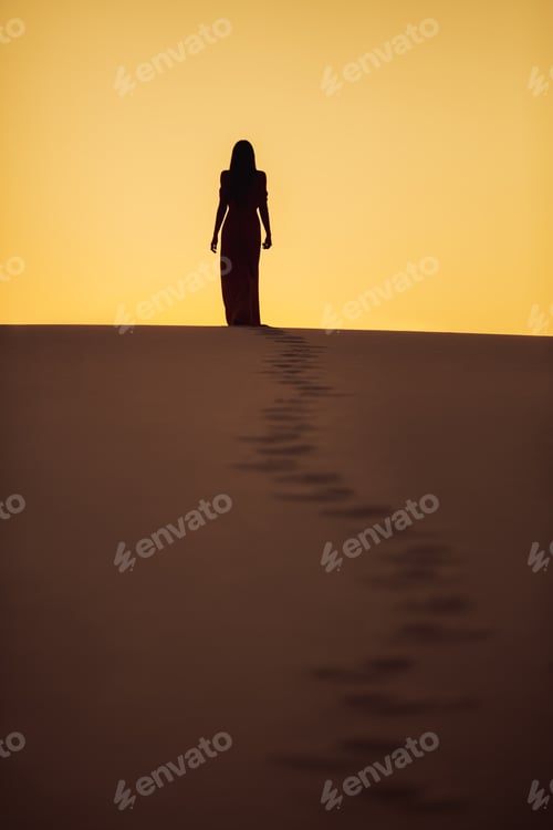 Preview: Desert Dunes and Silhouette of Walking Fashionable Woman Model