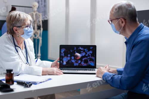 Preview: Medic talking about covid 19 bacteria on laptop to senior man, wearing face mask
