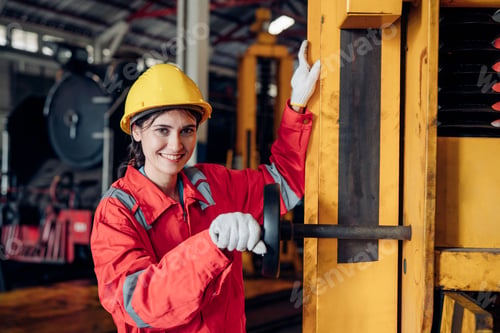 Preview: Portrait of woman engineer working in train factory.
