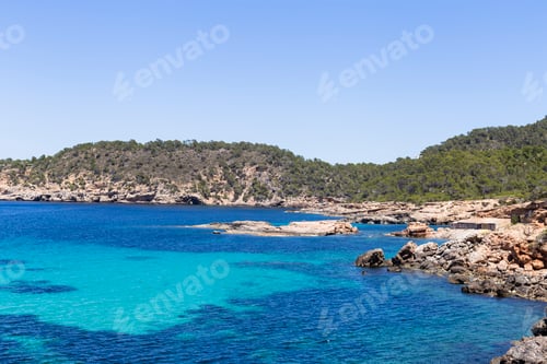 Preview: beautiful landscape in Ibiza of blue ocean in a sunny day with boats