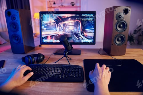 Preview: Hands on the mouse and keyboard. Online streamer playing FPS shooter game at home