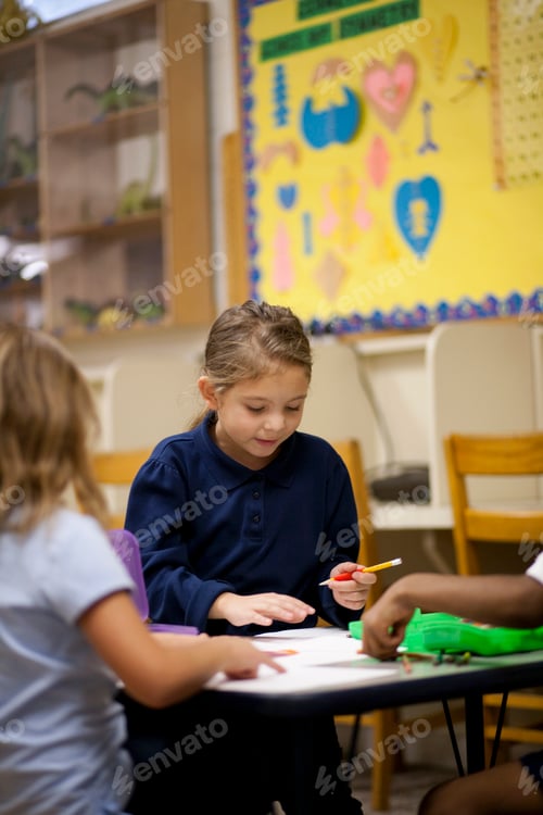Preview: Children writing in classroom