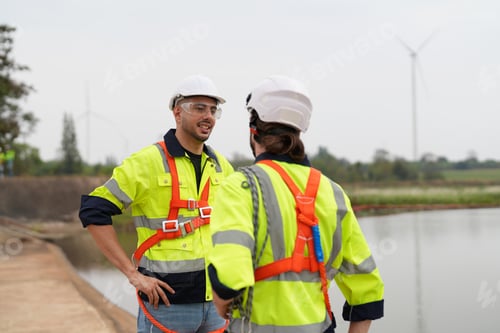Preview: Sustainable energy industry - Engineers working at alternative renewable wind energy farm
