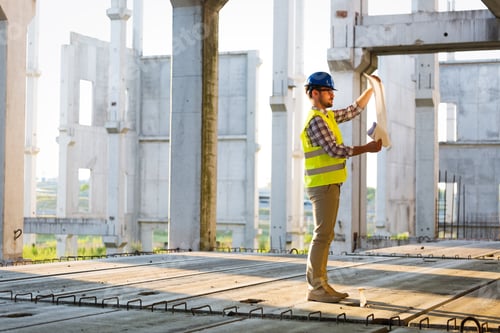 Preview: Picture of construction site engineer looking at plan