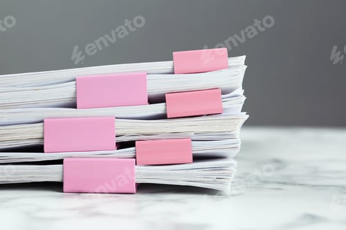 Preview: Stack of documents with binder clips on marble table, closeup
