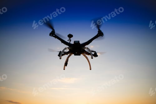Preview: Quadrocopter in flight at sunset