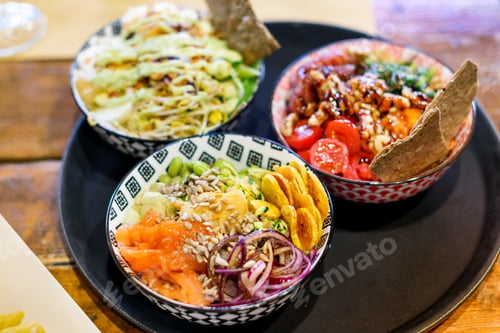 Preview: Bowls with various vegetables and seeds with fish on tray