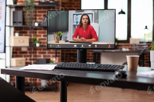 Preview: Close up of video call with woman on computer at desk