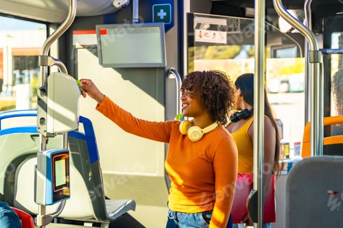 Preview: Young woman paying bus fare using validator