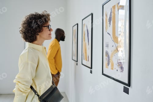 Preview: People enjoying art at gallery