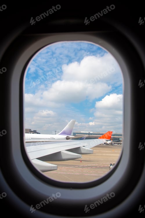Preview: Plane wings and the sky View from the passenger window