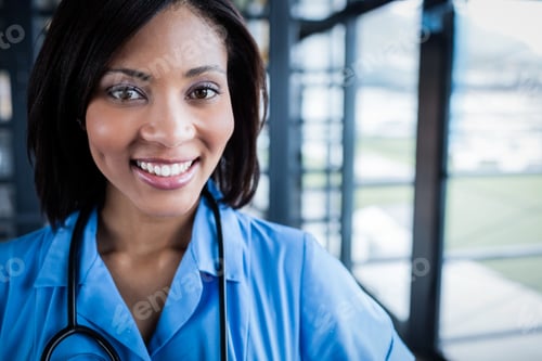 Preview: Smiling Woman Doctor in Blue Uniform