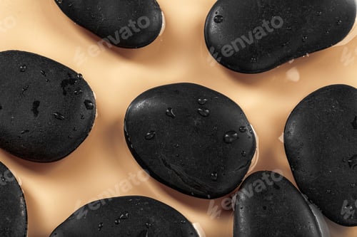 Preview: Massage spa stones close up in wavy water