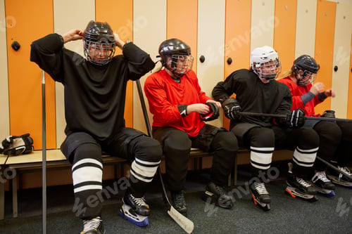 Preview: Female Hockey Team Getting Ready in Locker Room