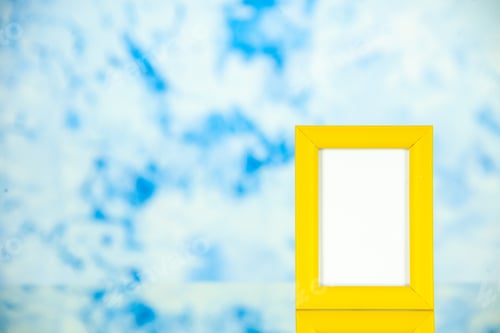 Preview: front view yellow picture frame on light-blue background portrait photo color shoot present family