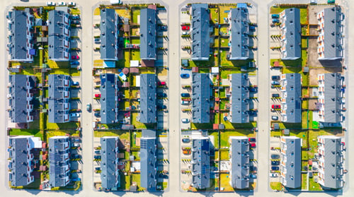 Preview: An aerial view of the houses and streets. A residential area in the suburbs.