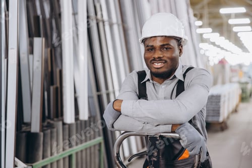 Preview: Factory worker leaning on pallet jack in warehouse of aluminum and pvc windows and doors