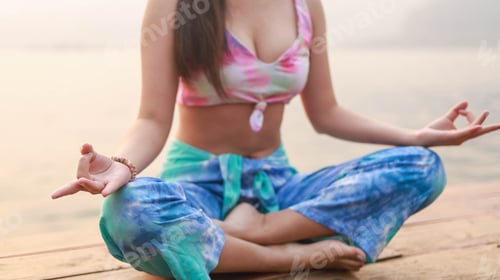 Preview: woman on Summer yoga at sunset seashore