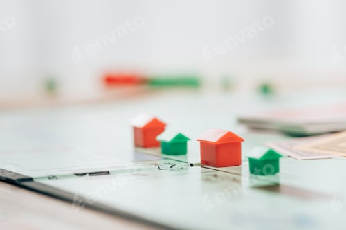 Preview: KYIV, UKRAINE - NOVEMBER 15, 2019: Selective focus of figures on monopoly board game