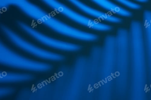 Preview: Beautiful monstera leaves shadow colored background in artificial light