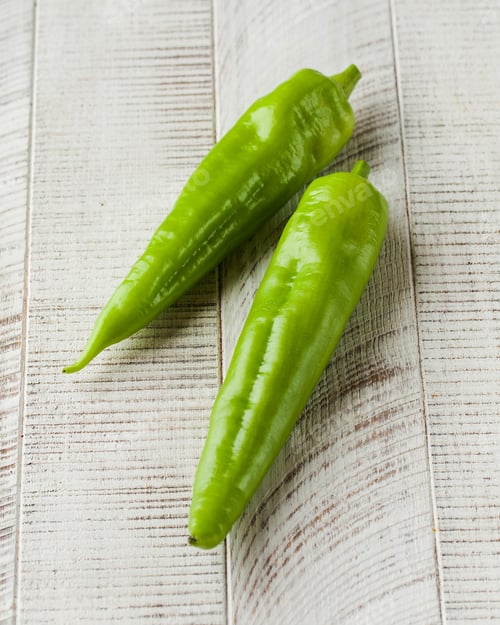 Preview: Fresh green capsicum on a white wooden background. Vegetables