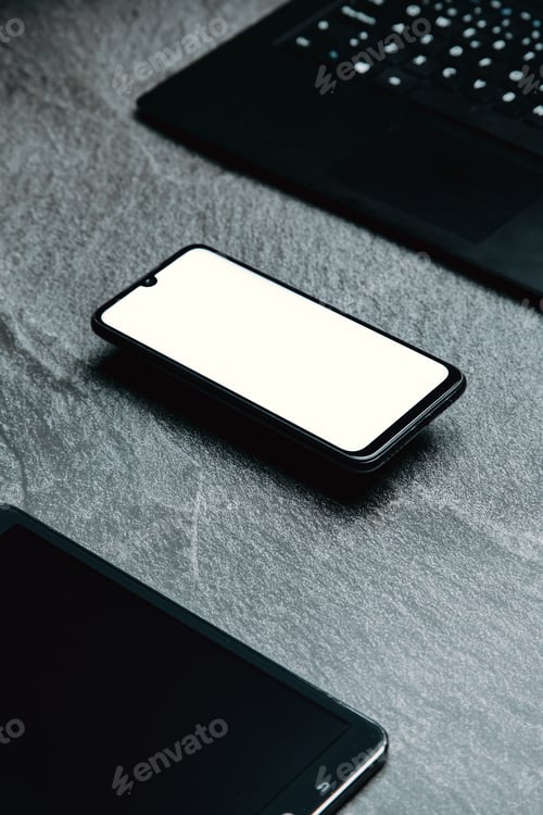 Preview: Stylized clean marble office working desk with smart phone, laptop