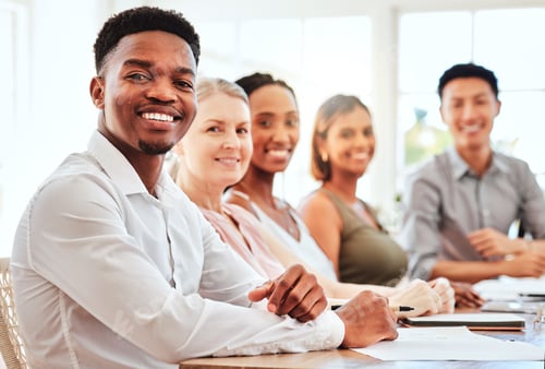 Preview: Business team, training and audience diversity with happy employees at table for teamwork meeting,