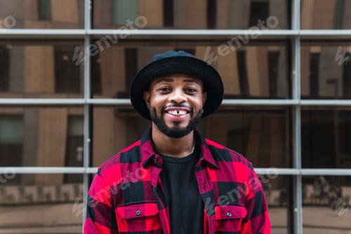 Preview: Cheerful black man in stylish outfit on street