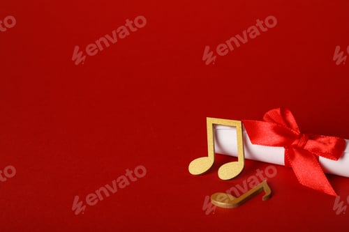 Preview: Golden notes with a scroll on a red background