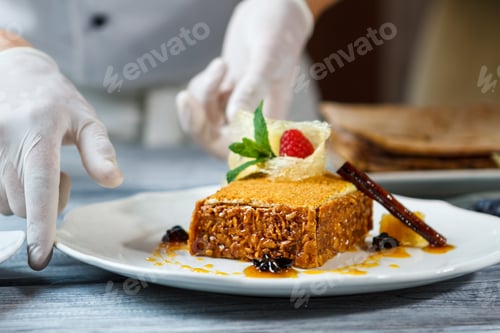 Preview: Hands touch plate with cake