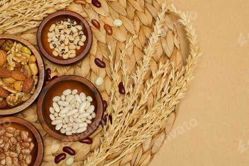 Preview: Flat lay of healthy grain concept, Various bean and almond in wooden bowl wheat on brown background
