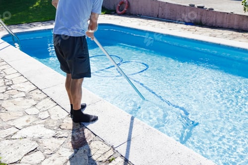 Preview: Man cleaning the pool at home, standing with the cleaner device, doing chores, housework, household