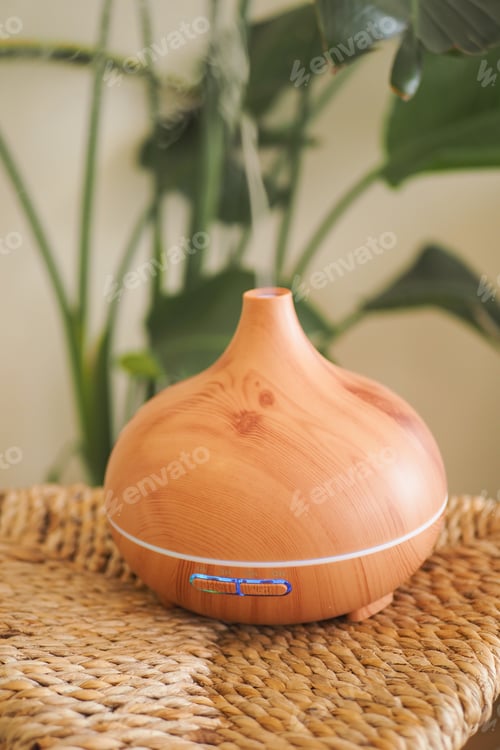 Preview: Wooden diffuser sits on woven basket in a bright room