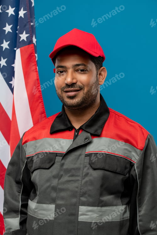 Preview: Young successful mixed-race factory worker or repairman in workwear
