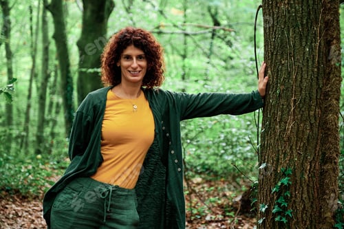 Preview: adult woman in a forest - autumn concept