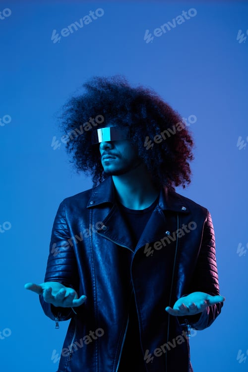 Preview: Portrait of fashion man with curly hair with stylish glasses on blue background multinational