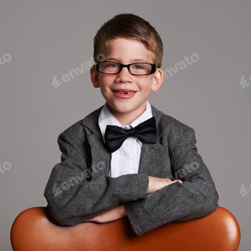 Preview: Hes a great dresse. Studio shot of a cute young boy wearing a retro suit against a grey background.