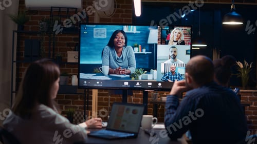 Preview: Employees planning strategy with remote team in teleconference app
