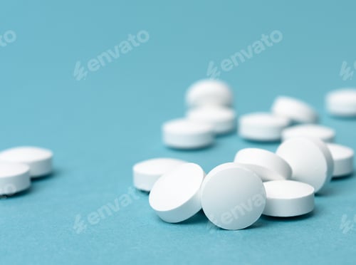 Preview: White round pill for healthcare. Medical treatment, bue background