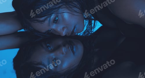 Preview: Neon blue, floor mirror and beauty model with creative reflection portrait, luxury cosmetics and ae