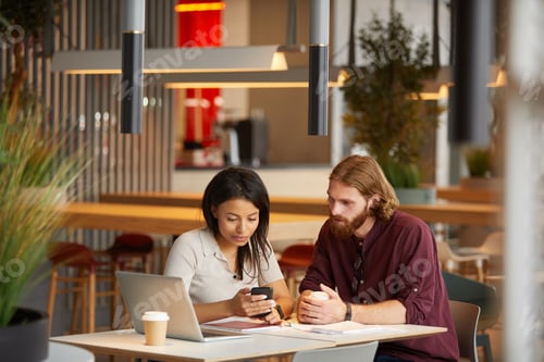 Preview: Teamwork during meeting in cafe