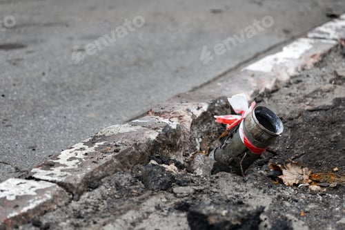 Preview: Fragment of a Russian rocket hail sticking out of the asphalt in the center of Kherson, Ukraine.
