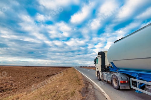 Preview: Truck on the road through countryside