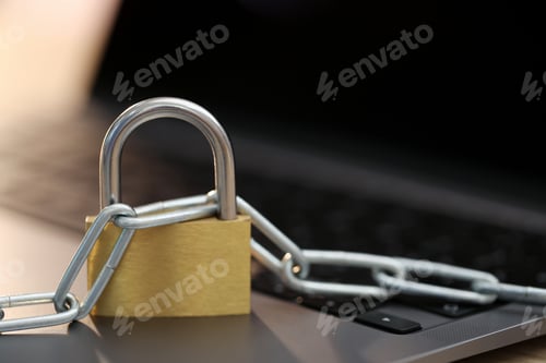 Preview: Cyber safety. Metal padlock with chain on laptop, closeup. Space for text