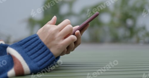 Preview: Close up of woman use of mobile phone