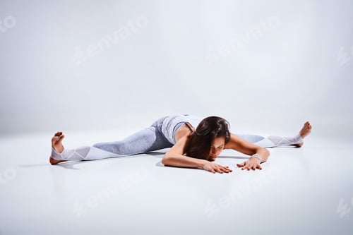 Preview: Woman doing yoga isolated on white background