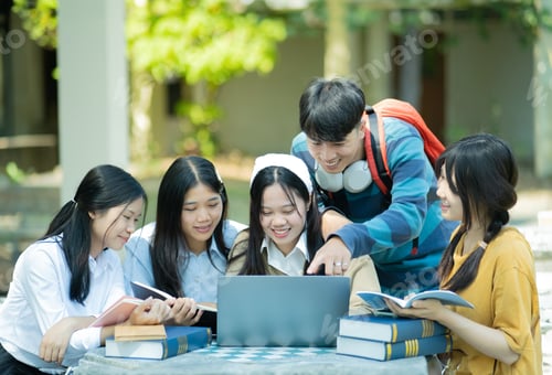 Preview: Group of students studying on campus outdoors